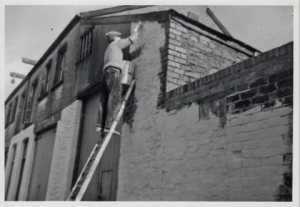 Re-painting following an air raid on Cardiff in 1941